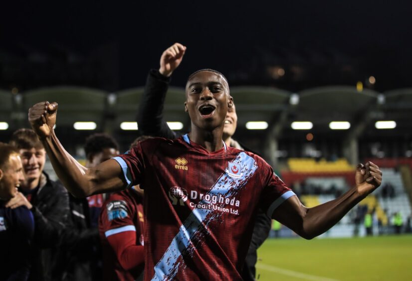 A teenage Emmanuel Adegboyega celebrates finding the net against Shamrock Rovers