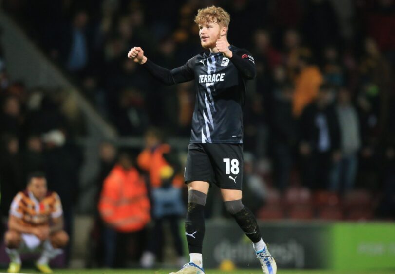 Luca Stephenson celebrates during his loan stint at Barrow