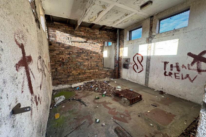 How the Kirkcaldy public toilet block looks inside, with graffiti and litter