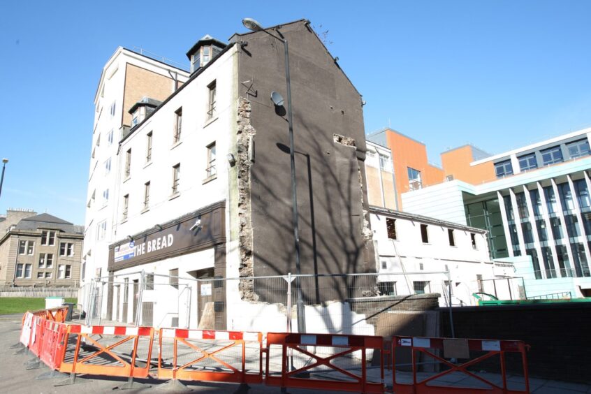 barriers surround the Bread as work begins on demolishing the once-famous Dundee pub.