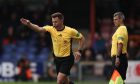 Referee Grant Irvine points to the spot as Ross County beat Dundee. Image: Shutterstock