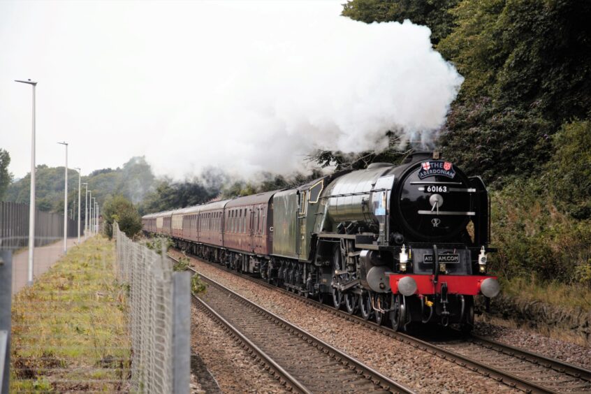 Steam train Tornado with an Aberdonian Railtour passing the site of the former Caledon Shipyard on September 2 2021, with steam 