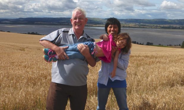 To go with story by Rebecca Baird. Colin Blair obituary Picture shows; Colin Blair with his wife Cyntia and their daughter Brylie. . Wedding in Spice Islands/playing with Brylie overlooking the Tay, in Fife. . Supplied by Image: Supplied.  Date; Unknown