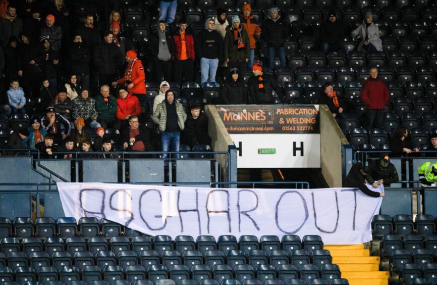 Dundee United fans demand change during a game at Rugby Park