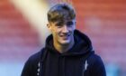 Lewis McCann smiles for the camera.