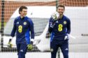 Jon McCracken shares a joke with former Norwich team-mate Angus Gunn in Scotland training. Image: Craig Williamson/SNS.