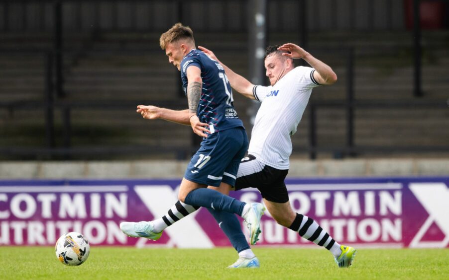 Wing-back Lewis Gibson gets on the ball against Ayr United.