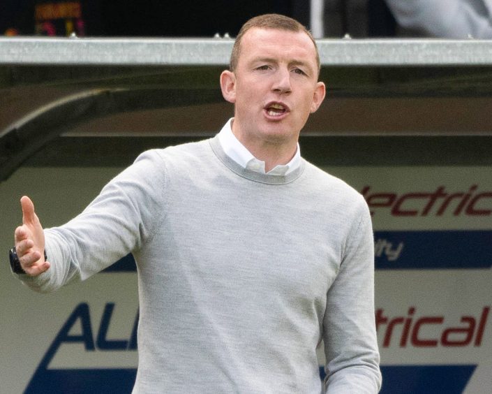 Neill Collins shouts instructions to his Raith Rovers players.