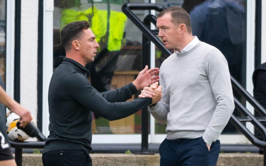 New Raith Rovers boss Neill Collins shakes hands with Ayr United counterpart Scott Brown.