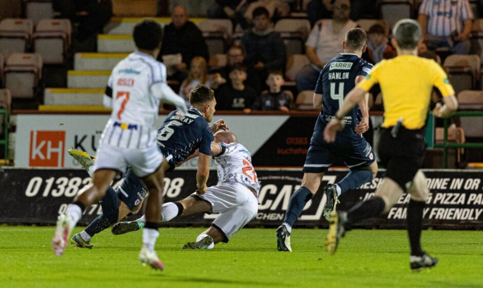 Raith Rovers Euan Murray (second from left) brings down Dunfermline Athletic striker Chris Kane.