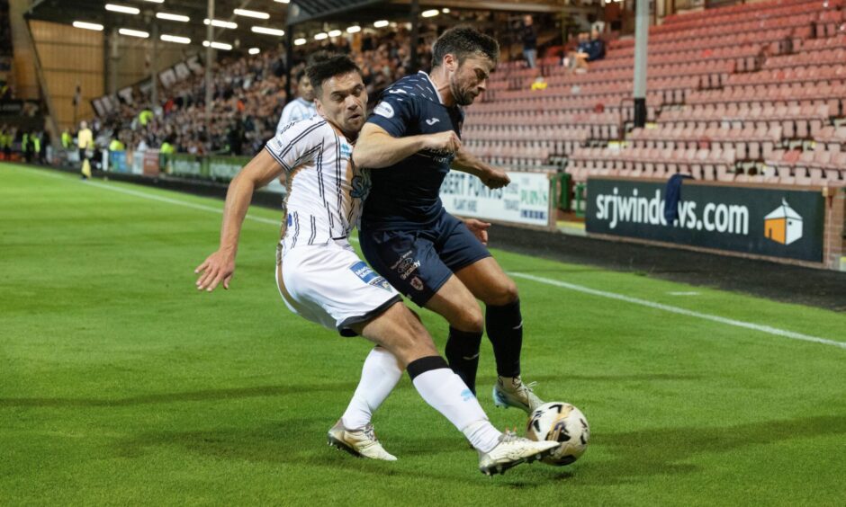 Lewis Stevenson (right) challenges Dunfermline defender Aaron Comrie