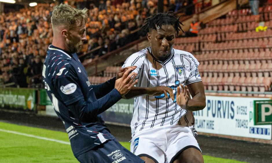 Lewis Jamieson challenges Dunfermline defender Kieran Ngwenya during the Fife derby.