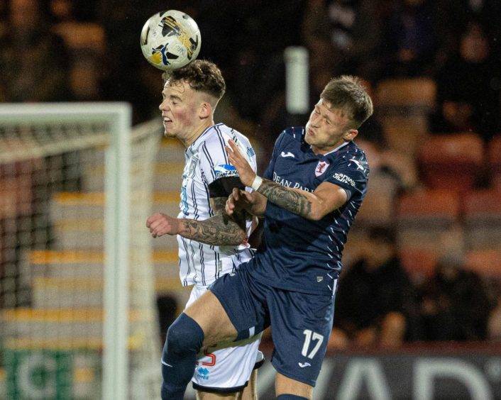 Dunfermline Athletic defender Sam Young beats Raith Rovers winger Lewis Gibson to a high ball in the Fife derby.