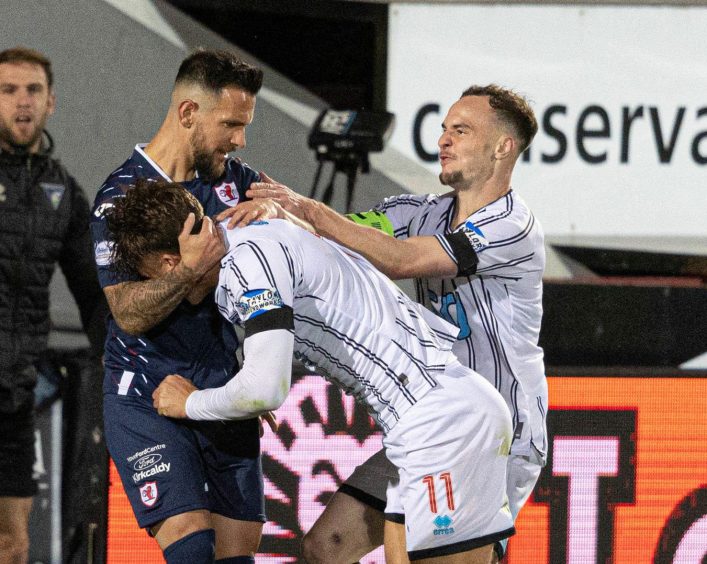 Raith's Dylan Easton and Dunfermline duo Lewis McCann and Chris Hamilton scuffle.