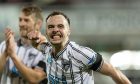 Dunfermline Athletic F.C. skipper Chris Hamilton celebrates at full-time.