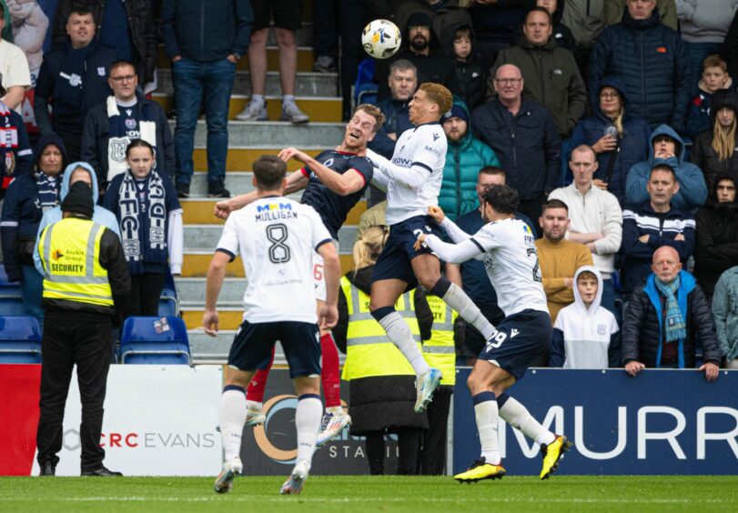 VAR said this challenge from Ethan Ingram was a penalty kick. Image: Paul Devlin/SNS