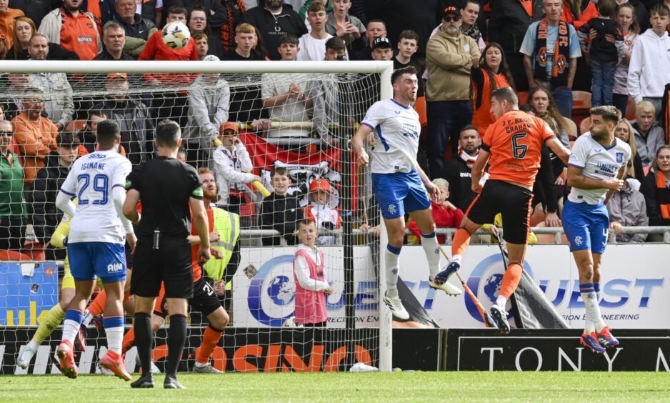 Dundee Uinted's Ross Graham heads wide of the post against Rangers