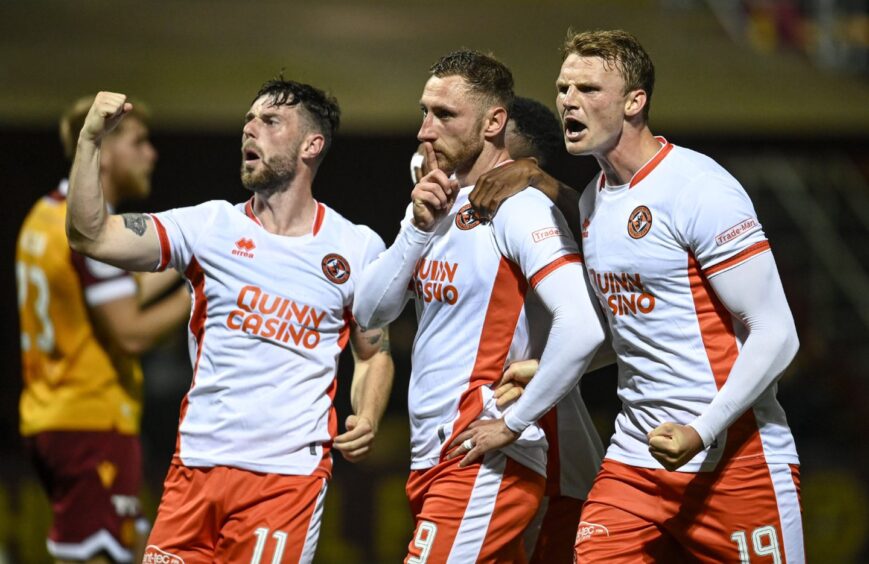 Dundee United's Louis Moult's usual finger to lips celebration