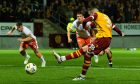 Motherwell's Lennon Miller makes no mistake from the spot.