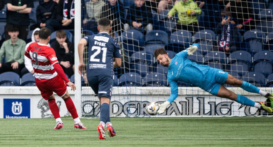 Kevin Dabrowski almost gets his hand to Kevin O'Hara's penalty for Hamilton Accies.