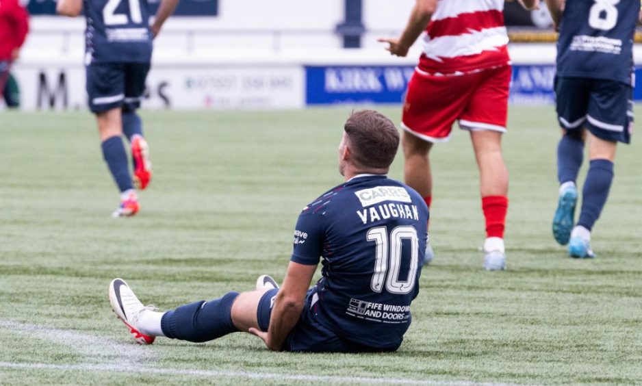 Raith's Lewis Vaughan clutches his left leg after injuring his hamstring against Hamilton Accies.