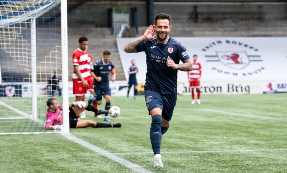 Dylan Easton cups his ear as he celebrates putting Raith Rovers 3-1 ahead against Hamilton.