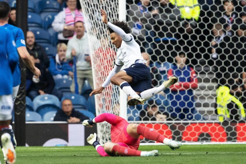 Dundee loanee Seun Adewumi was sent flying by Gers keeper Jack Butland. Image: Alan Harvey/SNS