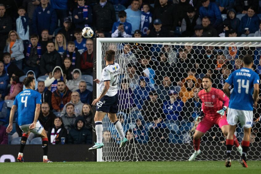 Seb Palmer-Houlden sees a header fly wide. Image: SNS