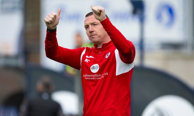 Manager Neill Collins gives the thumbs up to the Raith Rovers supporters.