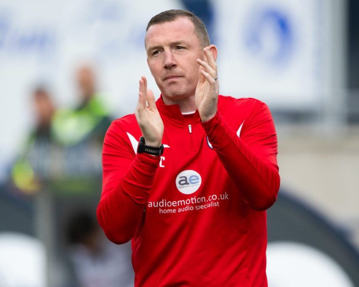 Raith Rovers manager Neill Collins claps the fans.