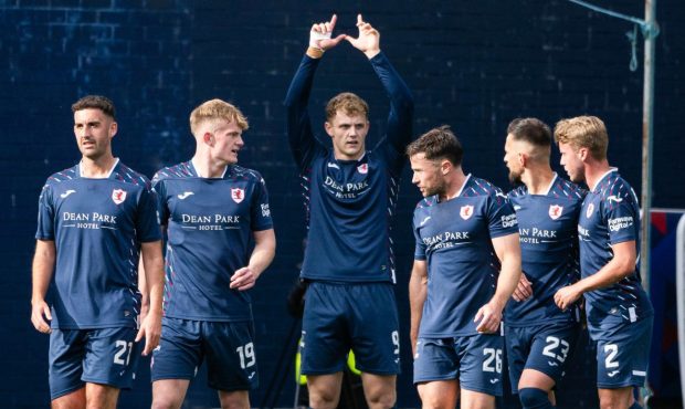 Raith Rovers celebrate Jack Hamilton's winning penalty against Falkirk.