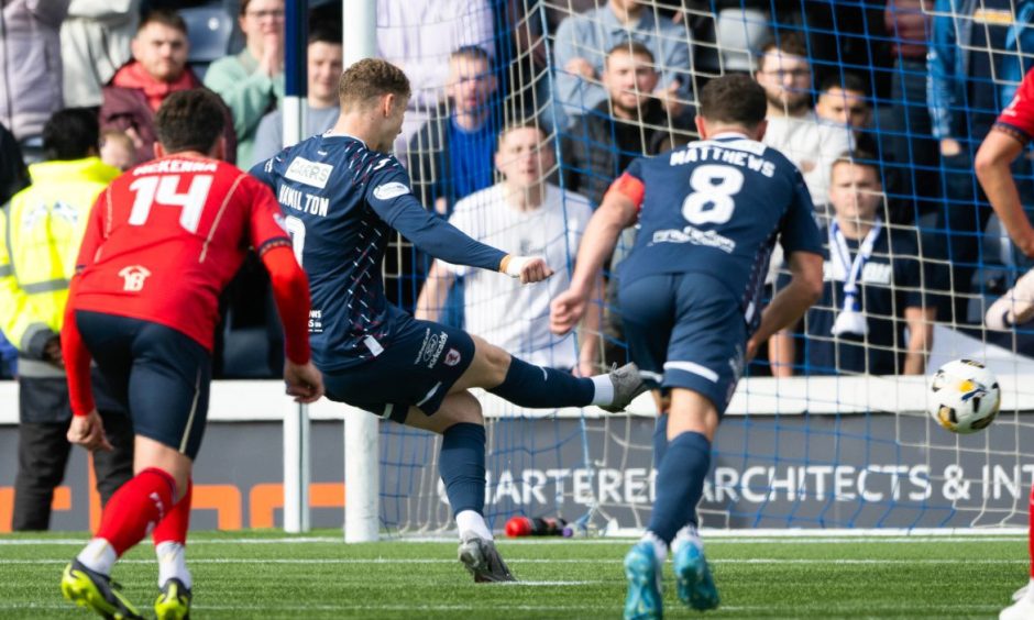 Jack Hamilton slots home his match-winning penalty against Falkirk.