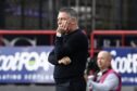 Frustrated Tony Docherty watches on as Dundee fell to their first home defeat of the season. Image: SNS