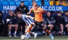 Dundee United's Luca Stephenson skips past Kilmarnock's Matty Kennedy at Rugby Park. Image: Alan Harvey/SNS