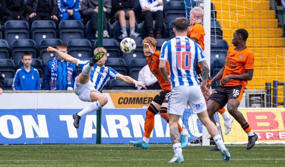 David Watson scores an overhead kick against Dundee United