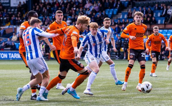 Kilmarnock's Fraser Murray (L) fouls Dundee United's Luca Stephenson, resulting in a penalty for the Tangerines at Rugby Park. Image: Alan Harvey/SNS