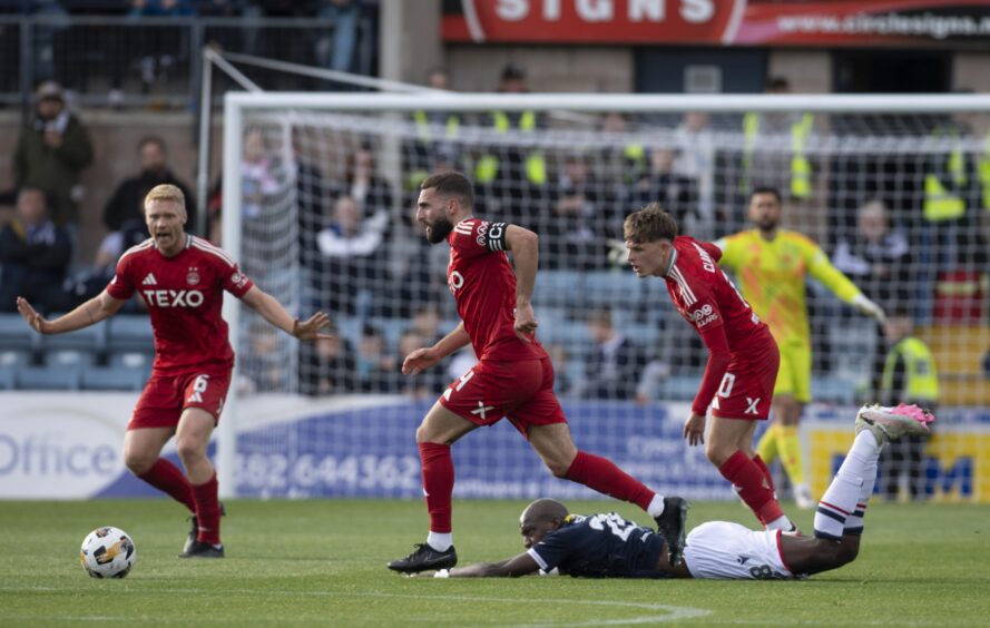 Mo Sylla goes down in midfield but no foul given before Aberdeen go 2-0 up. Image: Rob Casey/SNS