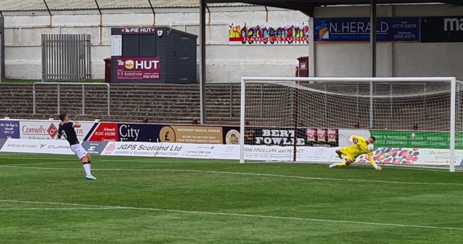 Dave Richards saves from Josh Mulligan as Dundee United beat Dundee in the Reserve Cup shootout. Image: George Cran