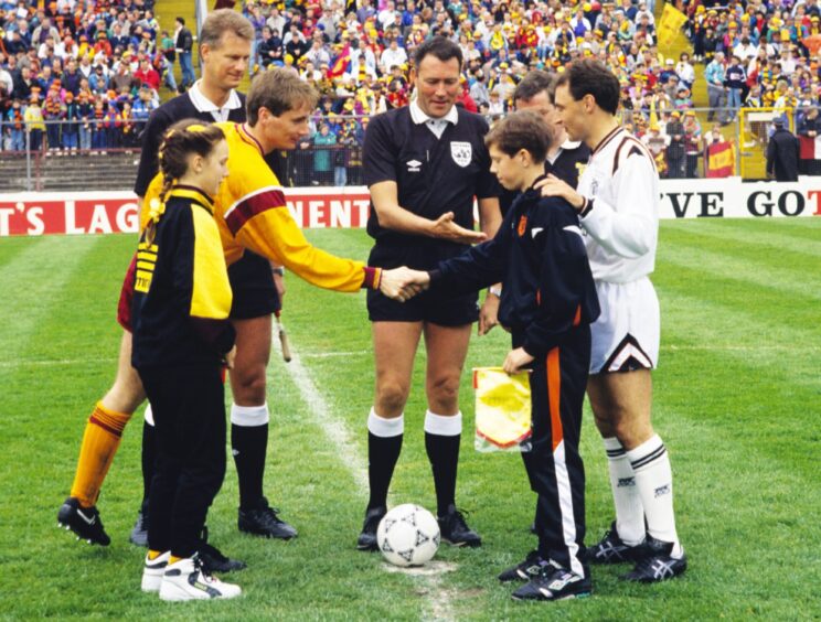 the captains, mascots and officials at the centre of the Hampden Park pitch ahead of Dundee United V Motherwell Scottish Cup final 