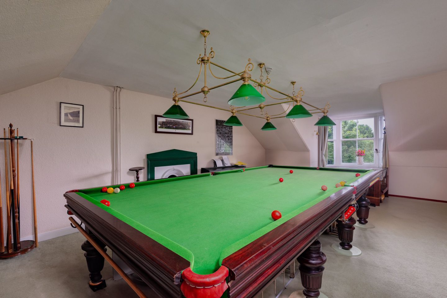 One of the bedrooms is used as a pool room.