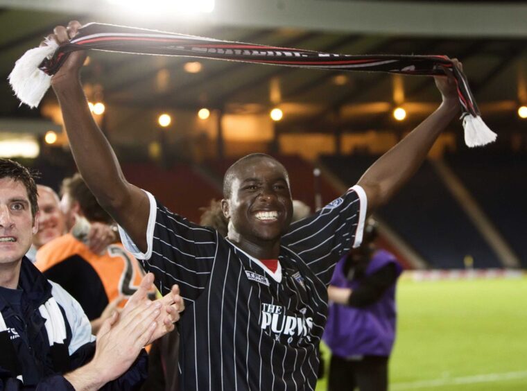 Sol Bamba holds aloft a Dunfermline scarf at Hampden after the Scottish Cup semi-final victory over Hibernian in 2007.