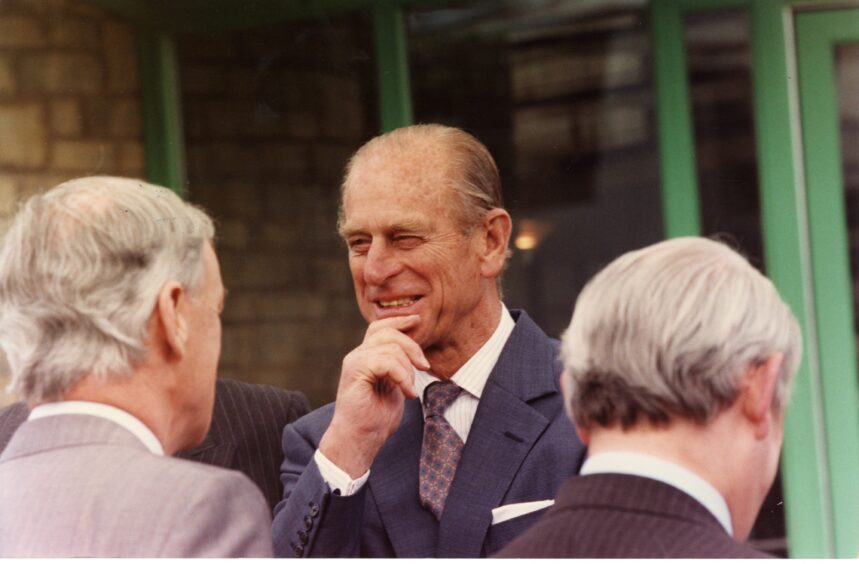 A smiling Prince Philip meets officials outside Lauder College in 1993. 