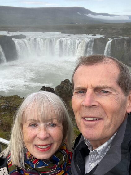 Allan Henderson and his wife Sheila at the Godafoss Waterfall in Iceland. 