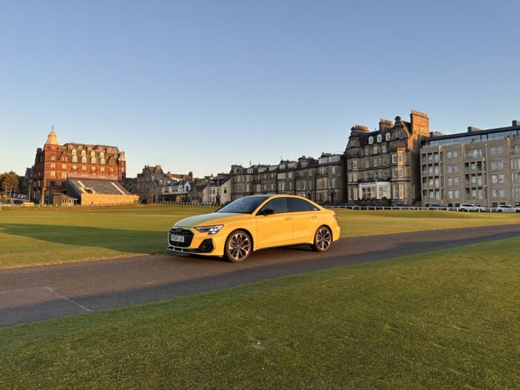 The Audi S3 beside the home of golf