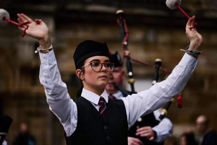 On opening night, Stirling and District Schools Pipe Band lead a procession through the cobbled streets of Stirling. Image: Bloody Scotland