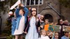 Group of children with placards outside Birnam Library