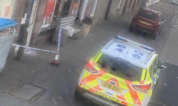 Police outside Burrelton Village Store on Wednesday.