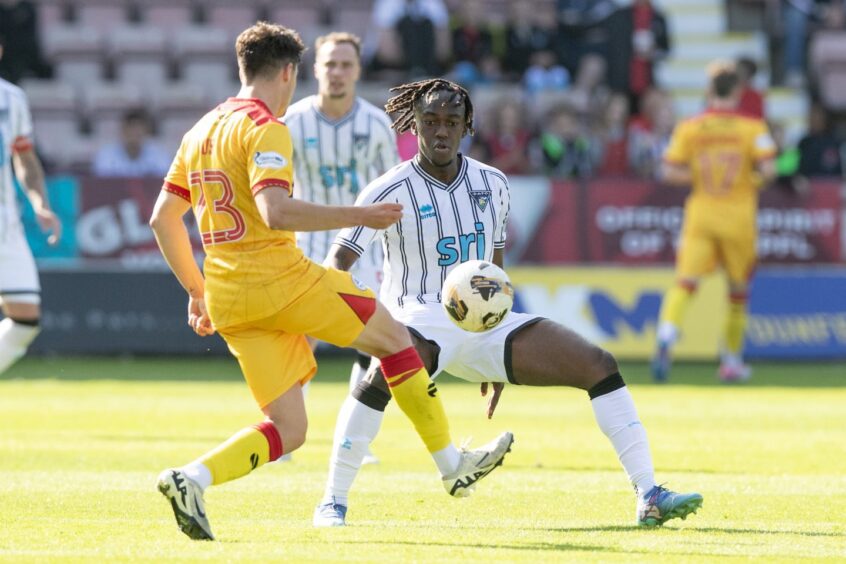 Dunfermline Athletic FC midfielder Ewan Otoo challenges for the ball against Ayr United.