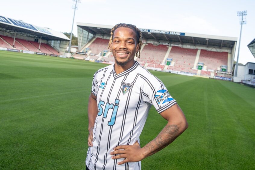 New Dunfermline Athletic F.C. signing Dapo Mebude smiles for the camera.