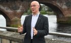 John Swinney speaking beside River Tay in Perth